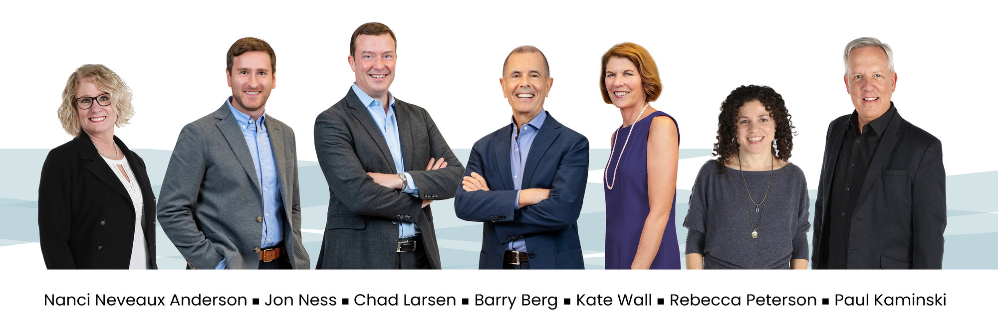 The Berg Larsen Group of professional realtors, on a white background. From left to Right: Nanci Anderson, Jon Ness, Chad Larsen, Barry Berg, Kate Wall, Rebecca Peterson, and Paul Kaminski.